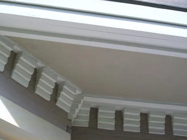 After: the finished soffit meeting the dentil trim at a corner of the roof